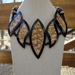 Vintage tagua necklace with black and natural-colored leaf-shaped pendants